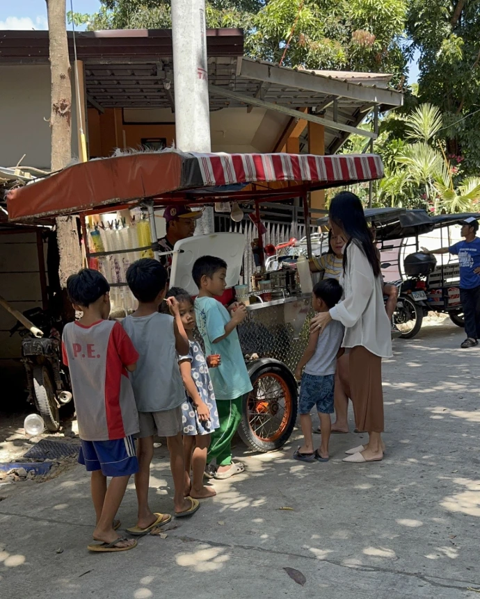 Children receiving free meals during community outreach program