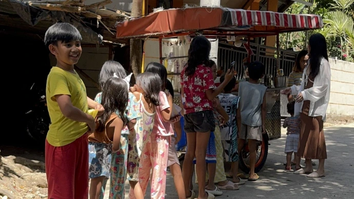 Kids enjoying meals provided by charity initiative